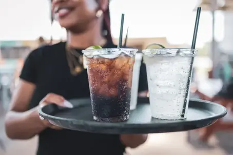waitress serving cold drinks